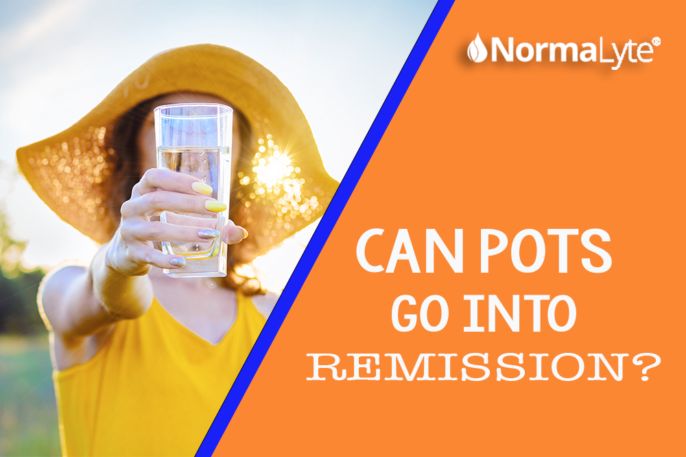 Can POTS go into remission? Woman in yellow standing in the sunshine with a glass of water stretched out. NormaLyte ORS Electrolyte Powder and Salt Capsules for POTS and Dysautonomia
