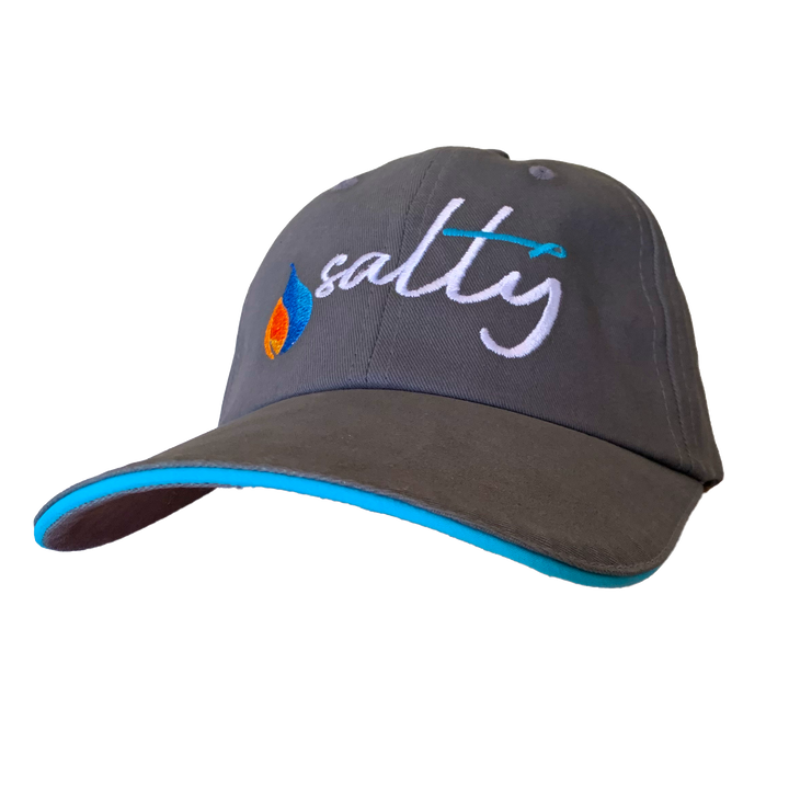 A gray baseball cap with 'SALTY' written in large white letters on the front, accented with a teal trim and an embroidered teal awareness ribbon.