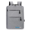 Gray NormaLyte durable everyday backpack for work and travel featuring front zipper pockets and the brand logo