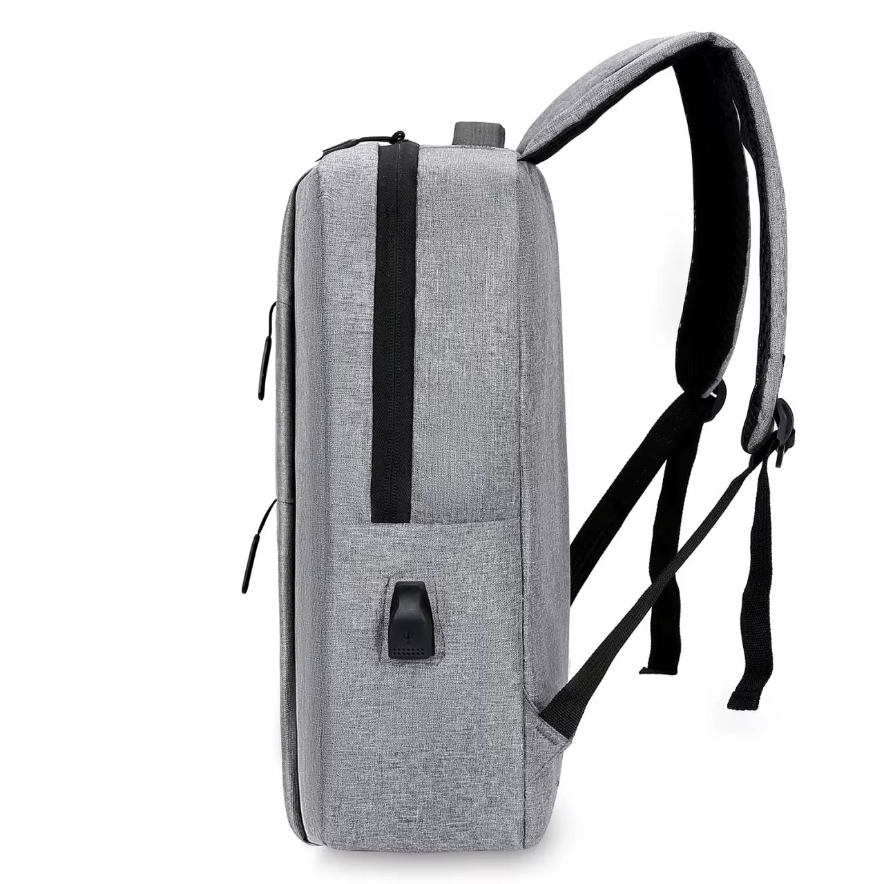 Side profile of the gray NormaLyte durable everyday backpack for work and travel, showing its slim design and external USB charging port