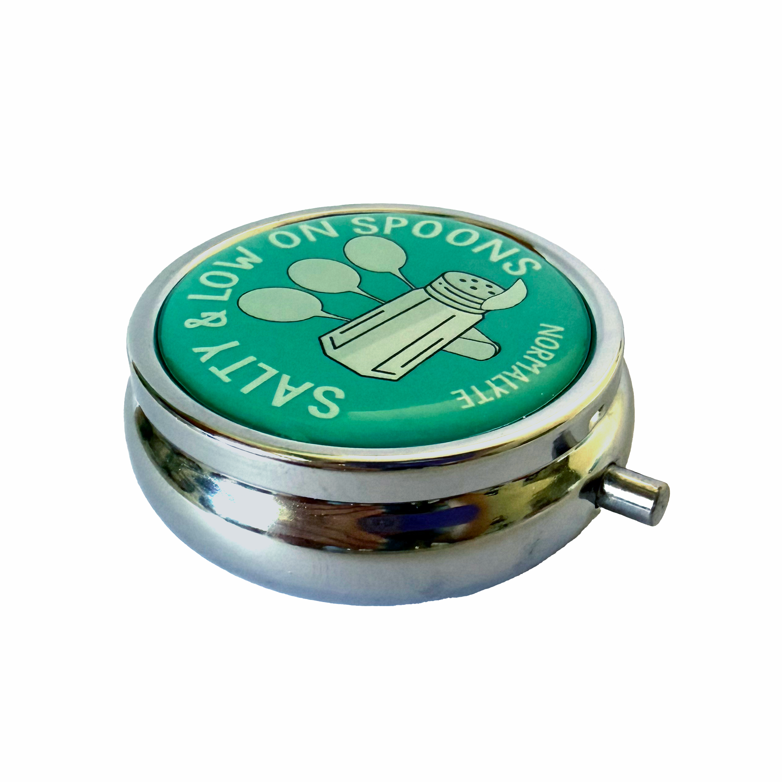 Closed NormaLyte Salty & Low on Spoons metal pill tin featuring a teal graphic with a salt shaker and three spoons